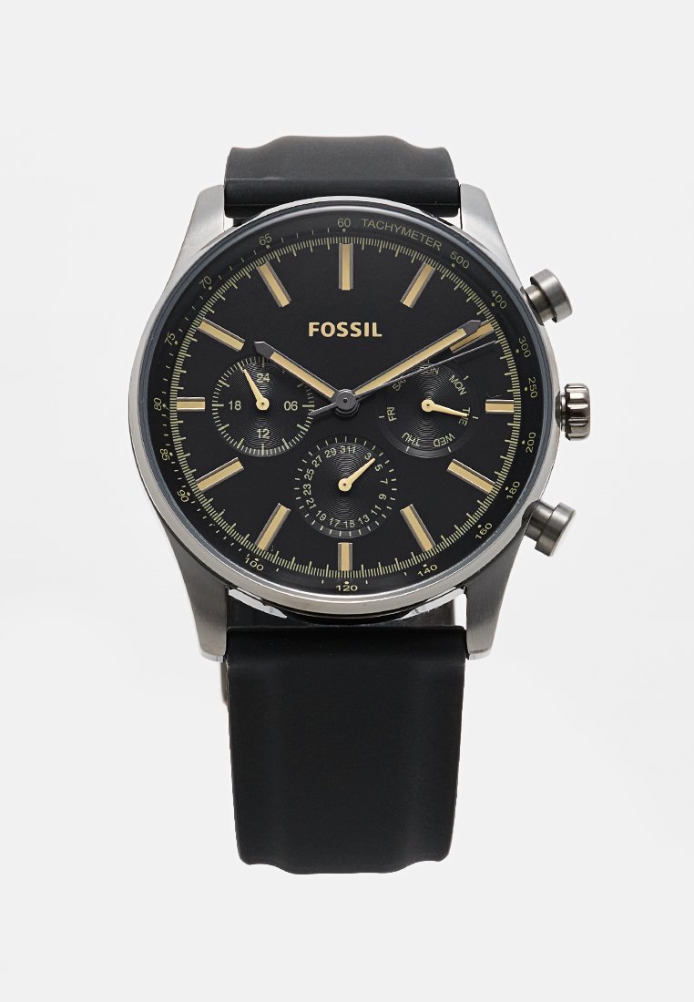 Orologio cronografo nero con cassa in acciaio inossidabile, indicatori dorati, quadranti secondari e cinturino in silicone nero. Include un tachimetro e un display della data.