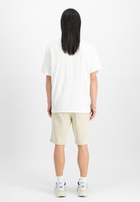 Alpha Industries BASIC SMALL LOGO - Pantaloni sportivi - vintage white