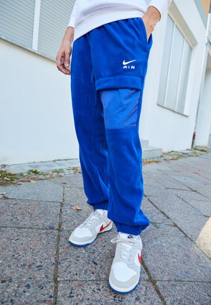 Nike Sportswear AIR WINTER PANT - Cargo trousers - deep royal blue/white
