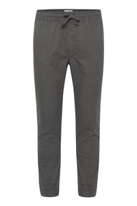 Gray cotton joggers with an elastic waistband and drawstring. Features tapered ankles and subtle texture without visible patterns.