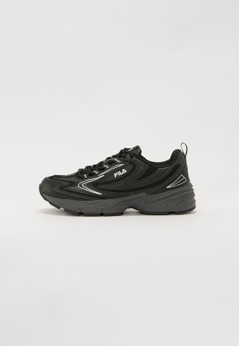 Black athletic shoe with mesh and synthetic upper, curved silhouette, rubber sole, and reflective accents on the sides.