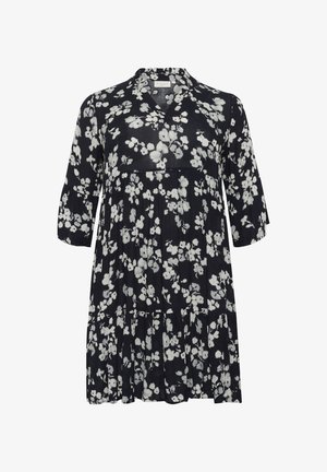 Ziedu raksts ar tumši zilu fona, baltas puķes, V-veida kakla izgriezums, trīs ceturtdaļu piedurknes un pakāpenisks volāns apakšmalā. Viegls audums.