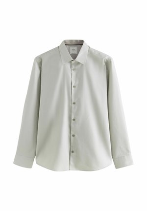 Camisa de manga larga de color verde claro con cuello con solapas, cierre de botones al frente y tela texturizada. Presenta un ajuste relajado y dobladillo redondeado.