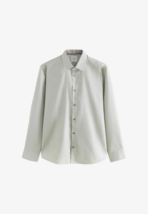 Vaaleanvihreä pitkähihainen paita, jossa kaulus, napillinen edusta ja teksturoitu kangas. Siinä on rento istuvuus ja pyöristetty helma.