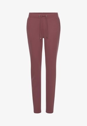 Pantalones ajustados y elásticos en un profundo color burdeos. Presentan una cintura con cordón y una tela suave, ligeramente brillante, con acentos de hardware metálico.