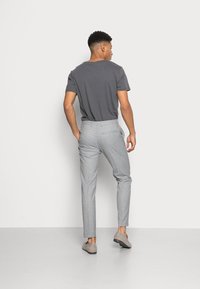 Calvin Klein Tailored SOFT STRETCH PIQUE PANTS - Chinos - light grey heather