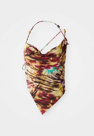 Halter top tie-dye dengan tali tipis dan detail manik-manik, menampilkan campuran warna merah, kuning, coklat, dan sedikit biru, diletakkan rata di atas latar belakang putih.