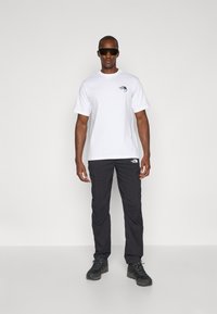 The North Face EXPLORATION TAPERED PANTS - Hlače za na prostem - black