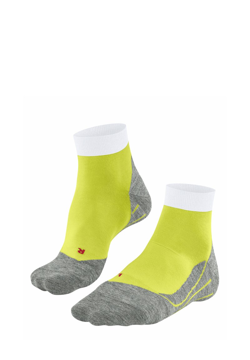 Calcetines tobilleros con una parte superior de color amarillo brillante y secciones inferiores grises y texturizadas. Presenta un puño blanco y un logo rojo en el lateral.