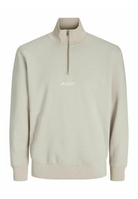 Light beige half-zip sweatshirt made of soft fabric, featuring ribbed cuffs and an embroidered logo at the chest. Smooth texture.