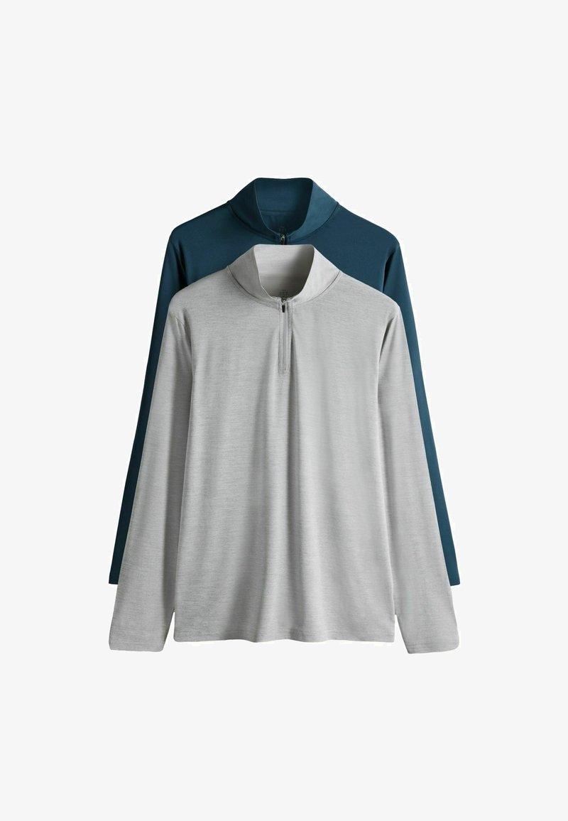 Deux hauts à manches longues avec fermeture éclair : un gris et un bleu sarcelle foncé. Les deux présentent un col montant et sont fabriqués dans un tissu doux et lisse.