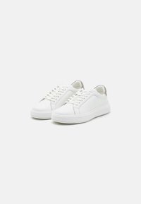 White leather sneakers with a rounded toe, lace-up design, and padded tongue. Featuring a smooth texture and a contrasting heel tab.