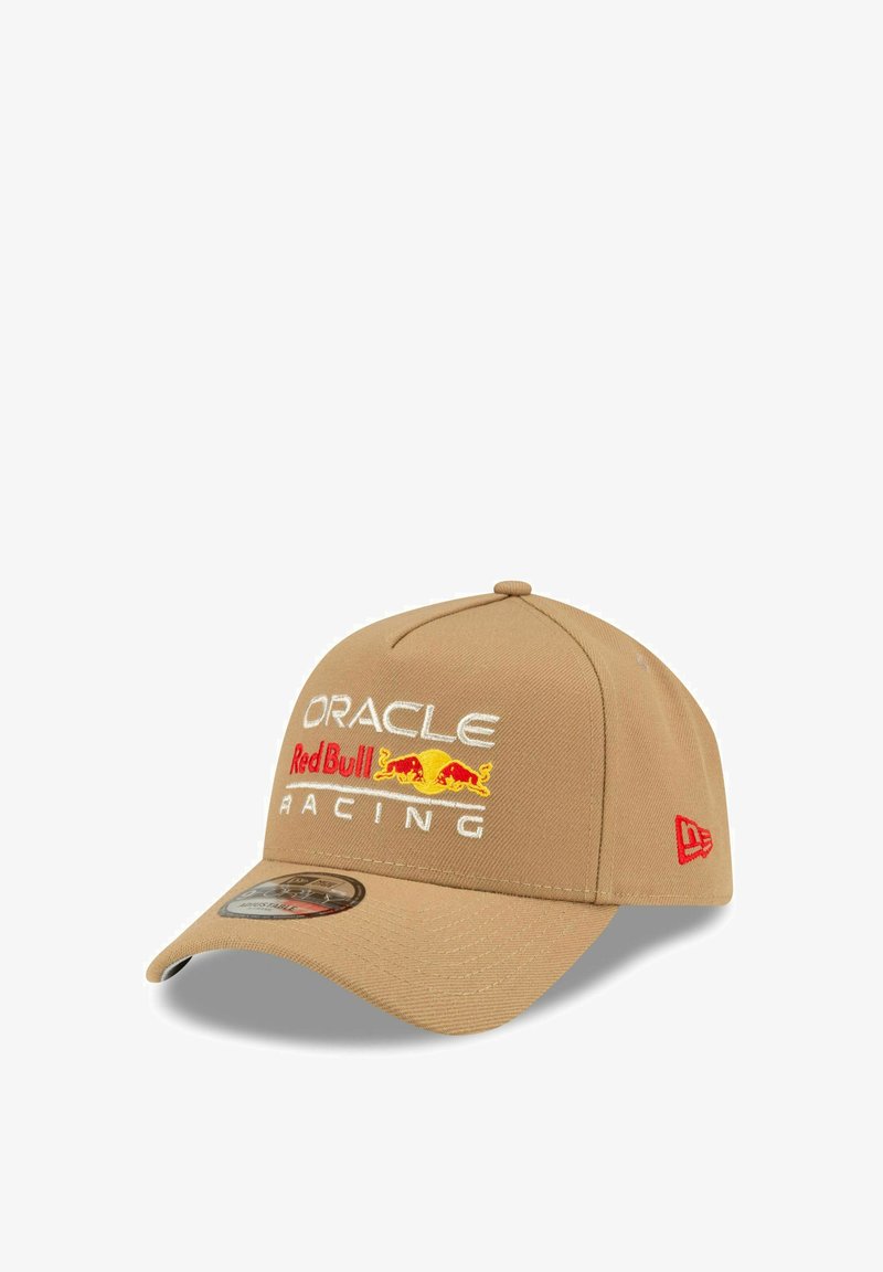 Tan baseball cap made of fabric, featuring embroidered logos in white, red, and yellow, with a curved brim and adjustable back strap.