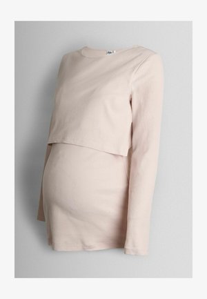 Pikkade varrukatega rasedustop pehmest ribakanga materjalist. Heleda beeži värvusega kihiliselt disainitud; rinna all tihedalt istuv mugavuse tagamiseks.