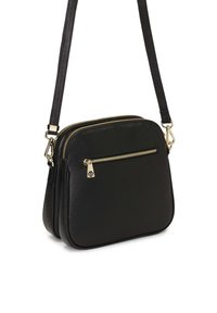 Borsa a tracolla nera con texture a bolla, due scomparti con zip, dettagli in metallo dorato e tracolla regolabile.