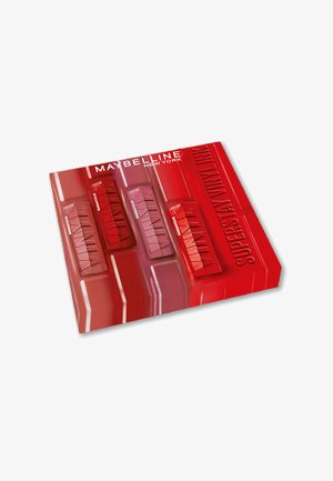 Le rouge à lèvres Maybelline New York Superstay Vinyl Ink dans un emballage rouge vif, comportant cinq fenêtres pour les produits à lèvres et un fini brillant.