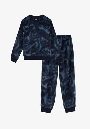 To-delt marineblå tie-dye waffle-strikket pyjamasæt med lange ærmer og elastiske manchetter på både top og bukser.