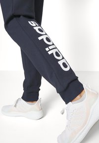 adidas Sportswear ESSENTIALS LINEAR CUFFED - Træningsbukser - legend ink