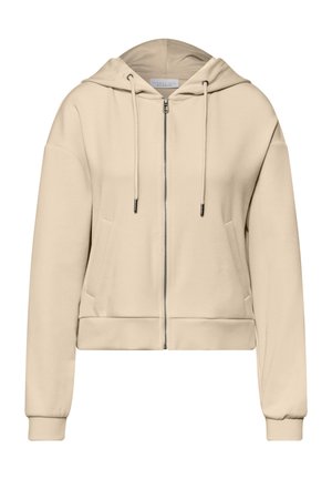 Sweat à capuche beige zippé avec cordons, poches avant, manches longues, poignets élastiques et capuche, présenté sur un fond blanc.