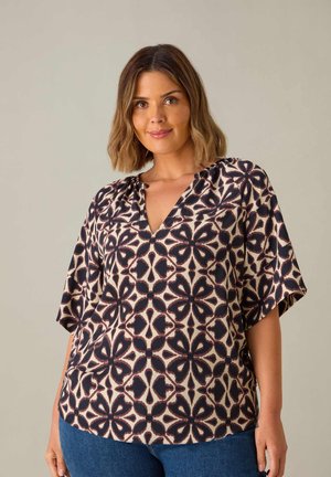 Kurzärmlige Bluse mit V-Ausschnitt, die ein florales Muster in Marineblau und Beigetönen aufweist. Sie besteht aus einem leichten Stoff mit weicher Textur.