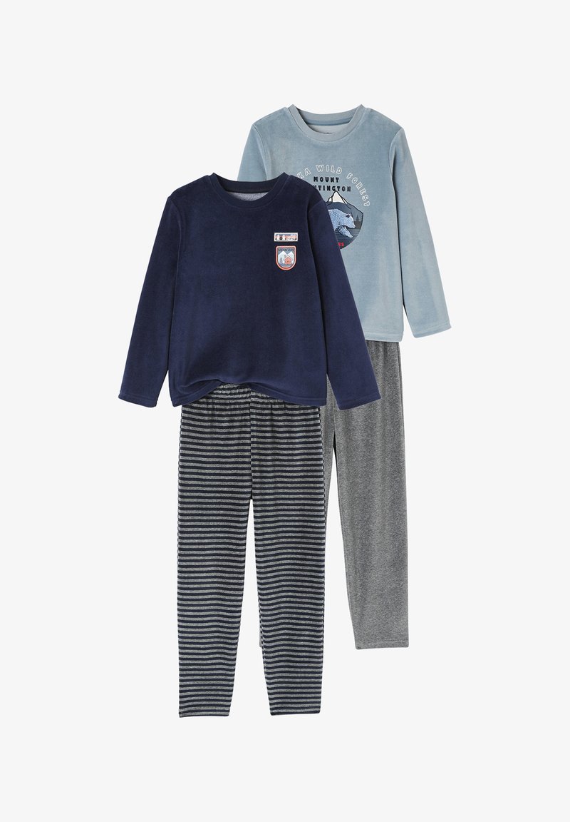 Two kids' fleece pajamas sets: one navy top with mountain patches and striped pants, one light blue top with mountain bear graphic and grey pants.