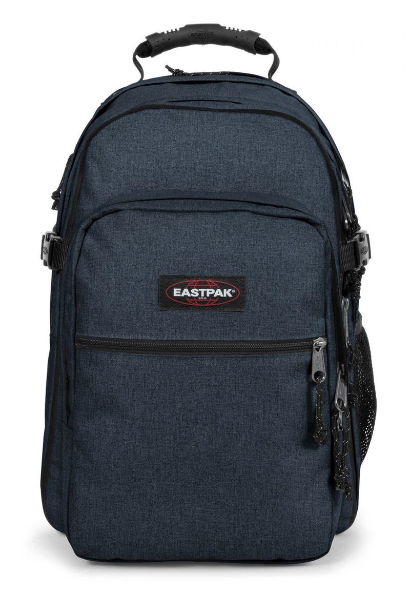 Zaino Eastpak blu scuro con tessuto testurizzato, molteplici scomparti con zip, spallacci imbottiti e una maniglia superiore per il trasporto.