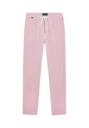 Pantalon à rayures rouges et blanches, coupe décontractée, doté d'une taille à cordon de serrage et de deux poches avant, fabriqué en tissu léger.