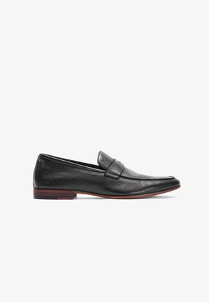 Black leather loafers with a smooth texture, featuring a stitched detail and a low wooden heel with a red accent.