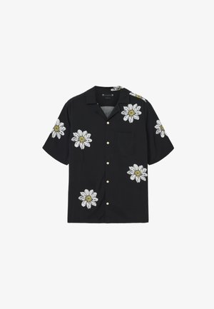 Black short-sleeve shirt with white and yellow floral embroidery, featuring a pocket and button front closure. Smooth fabric texture.