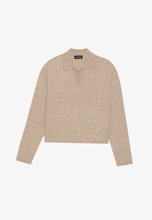 Beige knit pullover with a ribbed texture, long sleeves, and a collar. Design is cropped at the waist, featuring a subtle pattern throughout.