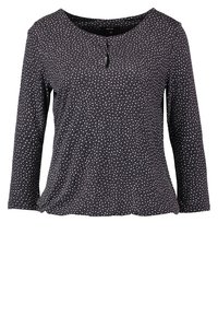 Långärmad topp i mörk marinblå med vita prickar, med en rundad halsringning och en knappdetalj framtill. Tillverkad av mjukt, lätt material.