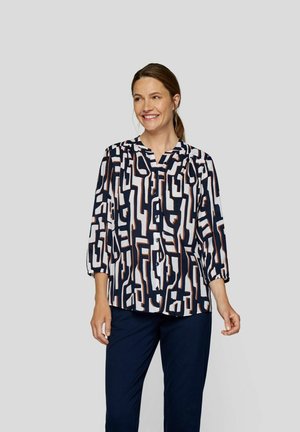 Hemdbluse mit geometrischem Muster in Marineblau, Weiß und Rost, mit halbärmeligen Ärmeln und lockerer Passform. Glatte Stoffstruktur.