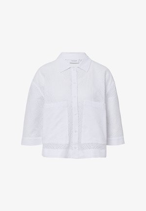 Weißes Hemd mit kragenfreiem Ausschnitt, kurzen Ärmeln und zwei Fronttaschen. Aus durchlässigem Stoff mit einem floralen Muster.