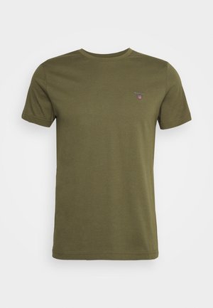 Olijfgroene T-shirt van katoen, met een ronde hals en korte mouwen. Klein logo-accent op de linkerborst. Soepele textuur.