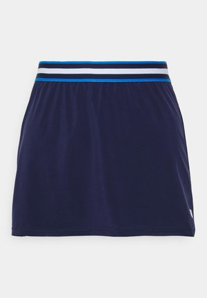 Marineblauwe sportrok met een elastische tailleband met zwart, wit en blauwe strepen, en een klein wit logo vlak bij de zoom.