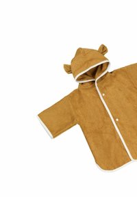 Brun frottéhuva poncho med kontrasterande vit kant och björnöron på huvan, med korta ärmar och knapplås.