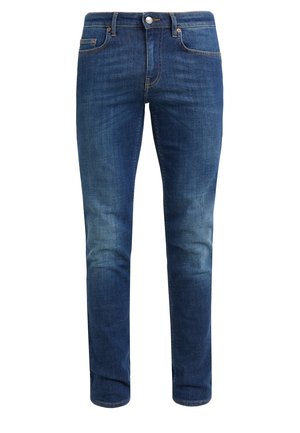 Tummansiniset slim fit -farkut, joissa kevyt haalistuma reisissä, fronttinappi, vetoketjuhalkio ja viiden taskun malli.
