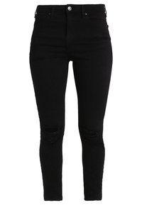 Černé skinny džíny vyrobené z džínsoviny, s roztrhnutými výřezy na kolenou. Design zahrnuje pět kapes a přední zapínání na knoflík.