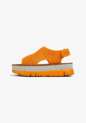 Orange mesh sandals with adjustable strap, chunky speckled platform sole in cream and orange, featuring cut-outs for breathability.