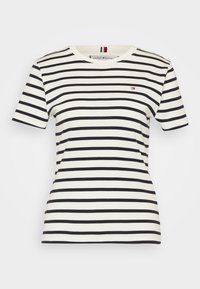 Pruhované bavlněné tričko s bílými a tmavě modrými horizontálními pruhy. Krátké rukávy, kulatý výstřih a malý detail loga na hrudi.