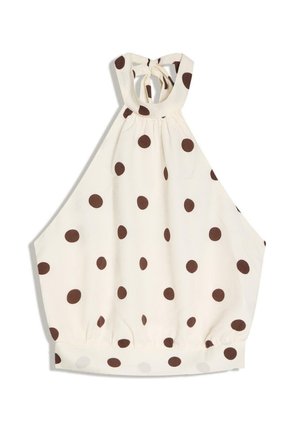 Blouse crème à col halter avec pois marron, encolure froncée et taille élastiquée.