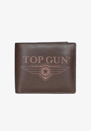 Ruskea nahkalompakko, jonka etupuolella on painettu "TOP GUN" -teksti ja siivekäs tähtivempele. Lompakko on suljettu ja ommeltu reunoilta.