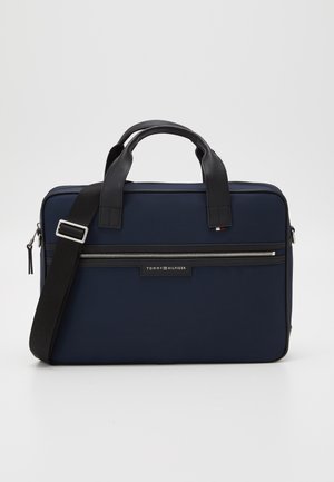 Marineblauer rechteckiger Aktenkoffer mit schwarzen Griffen, verstellbarem Schultergurt, vorderer Reißverschlusstasche und Tommy Hilfiger Logo-Patch.