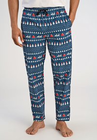 Marineblauwe pyjamabroek met een feestelijk patroon van sneeuwmannen, bomen en rode sleeën. Gemaakt van zachte, lichte stof met een elastische tailleband.