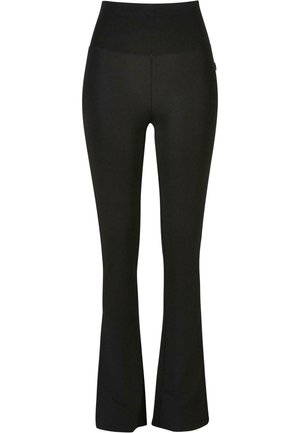 Schwarze, ausgestellte Leggings mit hohem Bund, aus einem glatten, dehnbaren Material. Sie verfügen über eine figurbetonte Silhouette und dezente Nähte.
