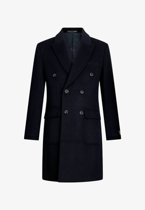 Divkāršā zila vilnas mēteli ar plašām atloks, sešiem melniem pogām un trim kabatām ar atloks, attēlots uz balta fona.