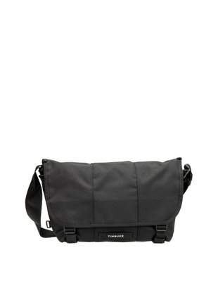 Black Timbuk2 messenger bag with flap closure, adjustable shoulder strap, and two buckle fasteners on front.