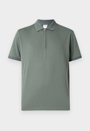 Polo shirt verde chiaro a maniche corte con colletto zip e dettagli a contrasto testurizzati sul colletto e sulle maniche. Tessuto elastico.