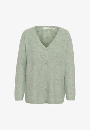 Hele roheline kardigan V-kaelusega, ribakonstruktsiooniga, pikkade varrukatega ja viie nööbiga ees. Pehme materjal ja mugav lõige.