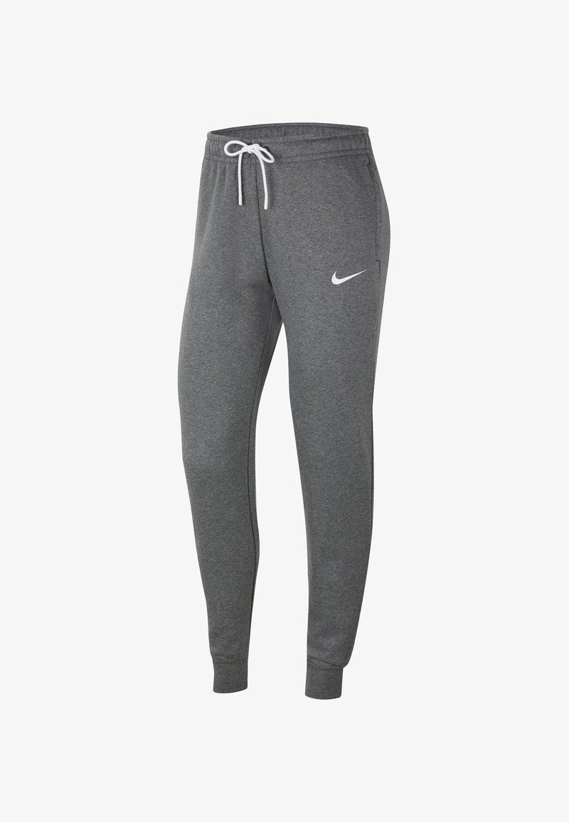 Pantalon de jogging gris foncé ajusté avec chevilles resserrées, cordon blanc, poches latérales et petit logo blanc Nike sur la cuisse gauche.